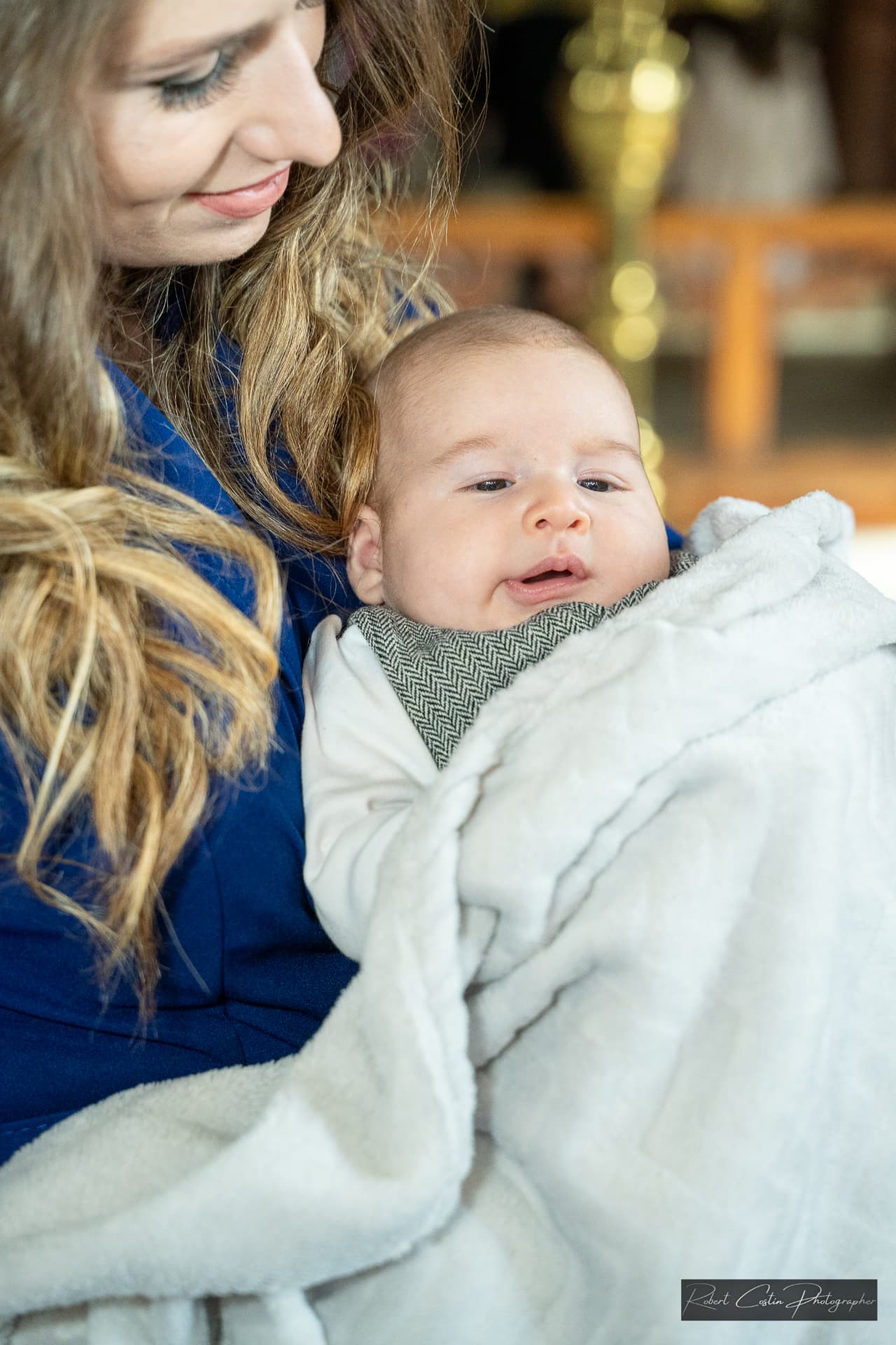 Botez — îmbrățișare în familie